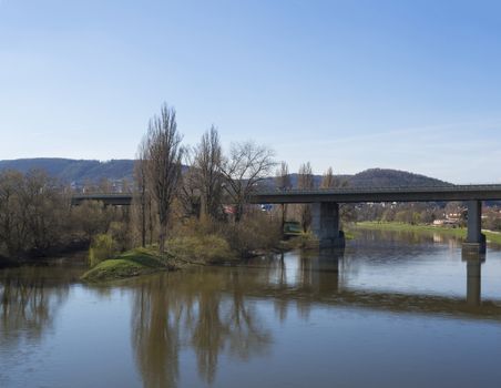 bridge for train over river Berounka, spring suny day.