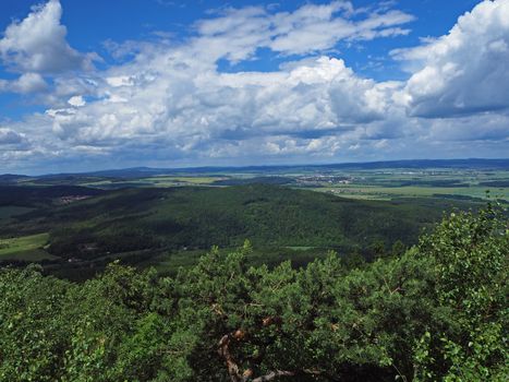 view from top of the mountain in Jeseniky - hills, trees, villages and blue sky and white clouds