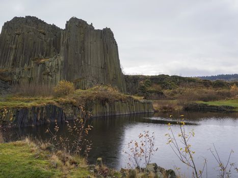 basalt pillars lava vulcanic rock formation organ shape with lake panska skala in kamenicky senov prachen czech republic