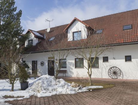 yard of renovated old farm house gest house vanuv statek near Pelhrimov end of winter snow