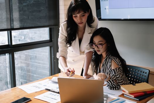 Close up business People Meeting to analyse and discuss and brainstorming the financial report chart data, Financial advisor teamwork and accounting concept.