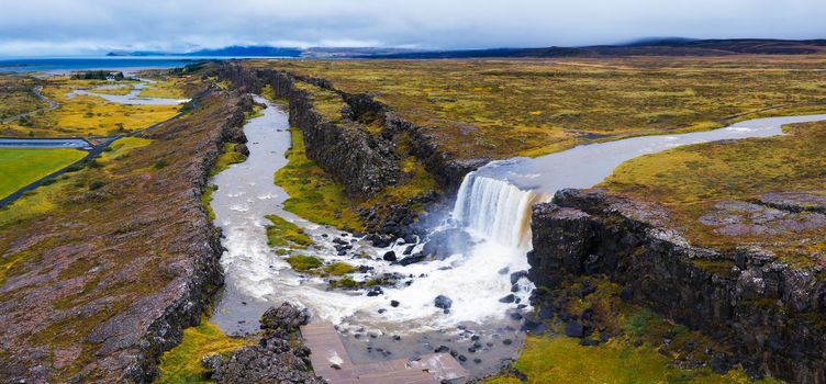Aerial panorama of the Oxarafoss waterfalls in Iceland. Oxarafoss also called Oxararfoss is located in the Thingvellir National Park on the Oxara River.
