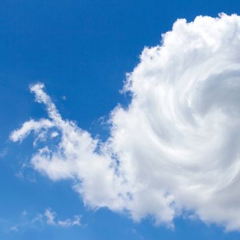 Cloud shaped like a snail against a blue sky. It can be used as a poster, wallpaper, design t-shirts. Fully editable.