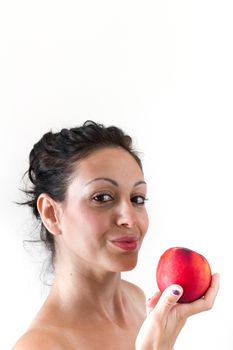 A girl while eating a peach, isolated on white background.