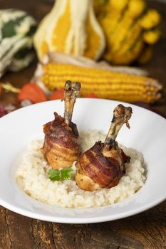 chicken legs with bacon on risotto