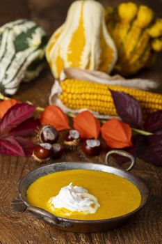 pumpkin soup on dark wood