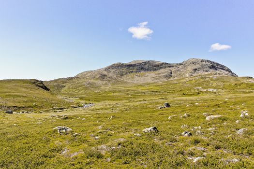 Beautiful Storebottåne river by the vavatn lake and mountains. Summer landscape in Hemsedal, Buskerud, Norway.