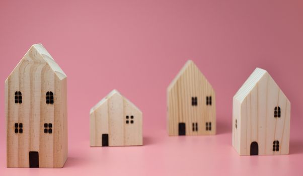 Mini residential craft house on a pink background