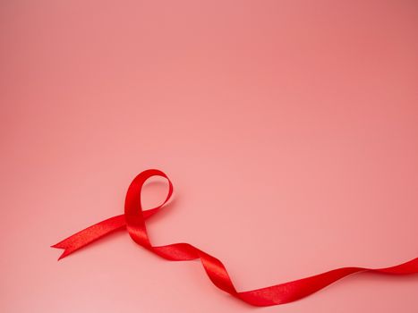 Symbol Red ribbon on pink background.