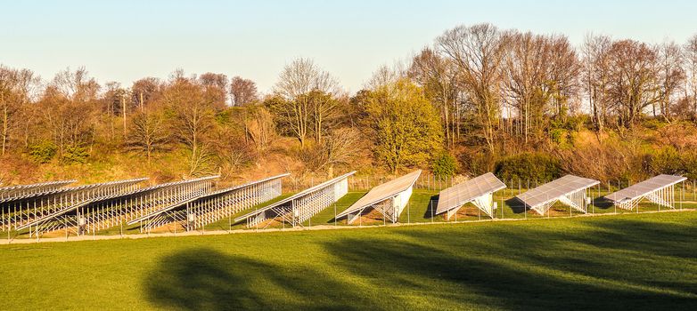 Generating clean energy with solar modules in a big park in northern Europe.