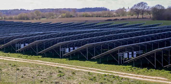 Generating clean energy with solar modules in a big park in northern Europe.