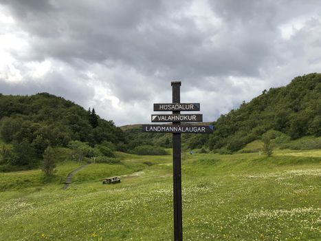 Thorsmork, Iceland, July 2019: Directional sign pole on Laugavegur hiking trail, pointing to husadalur, landmannalaugar, valahnukur