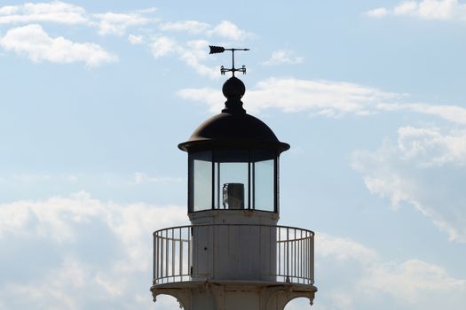 weather vane on the roof of the observation tower close-up against a cloudy sky