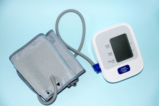 blood pressure monitor close-up on blue background