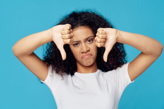 Sad woman gesturing with hands of lifestyle blue pattern background