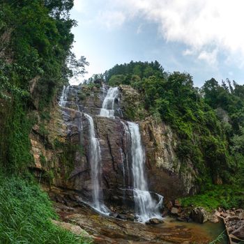 Fisheye wide shot of Ramboda Fall waterfall, Pussellawa Sri Lanka 