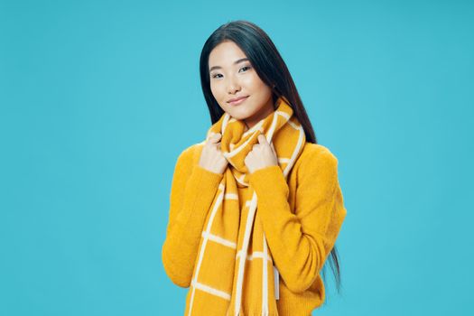 Ordinary woman in a warm sweater and a scarf around her neck