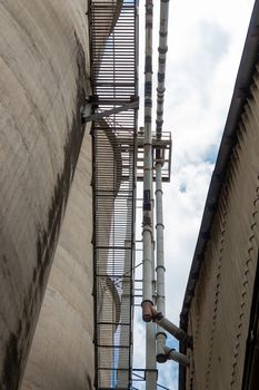 The cement silo represents data silos in computer science, which isolates data, since the only access door to the data is a single application