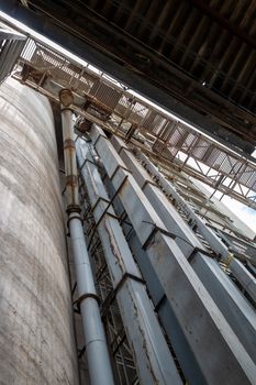 The cement silo represents data silos in computer science, which isolates data, since the only access door to the data is a single application