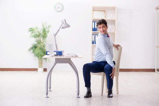 Employee doing stretching exercises in the office