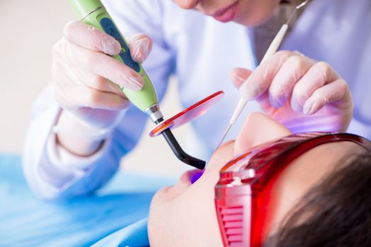 Patient visiting dentist for regular check-up and filling