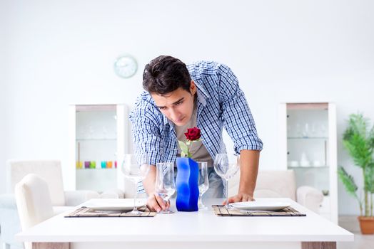 Man alone preparing for romantic date with his sweetheart