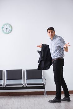 Man nervously impatiently waiting in the lobby
