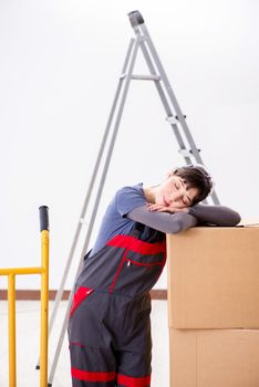 Woman contractor moving boxes in relocation concept
