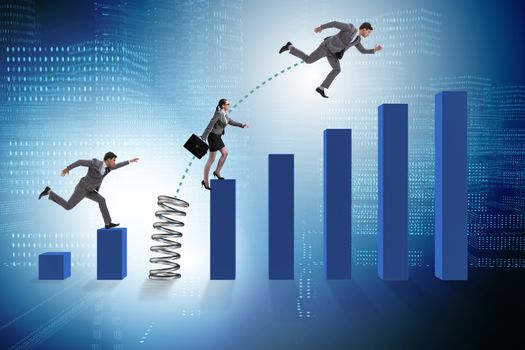 Business people jumping over bar charts