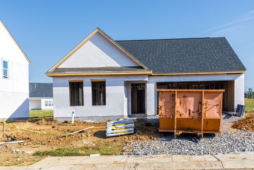 Horizontal shot of a single story house under construction.