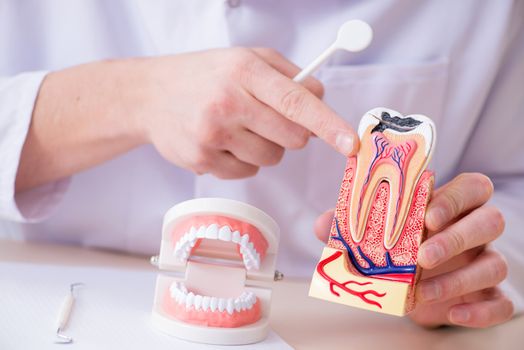 Dentist working teeth implant in medical lab