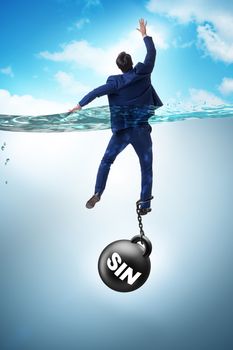 Businessman drowning under the burden of sin and guilt