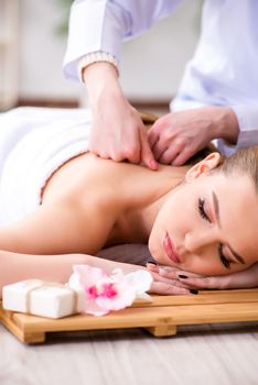 Young woman during spa procedure in salon