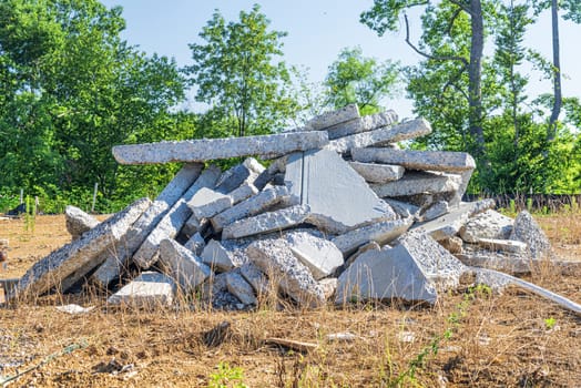 Horizontal shot of a pile of broken concrete slab pieces.
