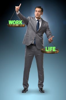 Businessman trying to find balance between home and work