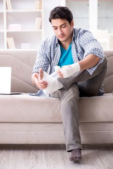 Young student man with injury at home