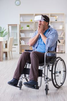 Disabled man studying with virtual reality glasses