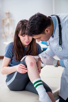 Patient visiting doctor after sustaining sports injury