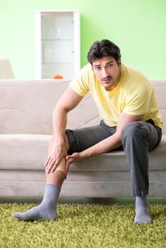 Man applying pepper Capsicum plaster to relieve pain