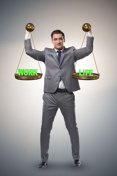 Businessman trying to find balance between home and work