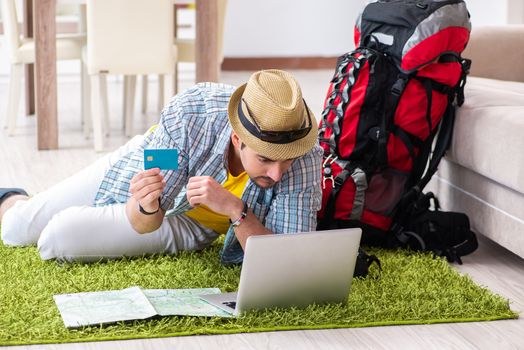 Young man planning his travel online