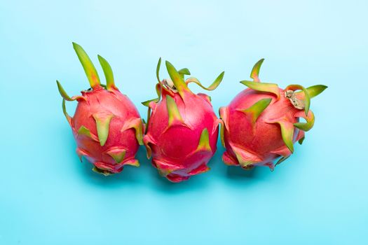 Dragon fruit or pitaya on blue background. Delicious tropical exotic fruit. Top view