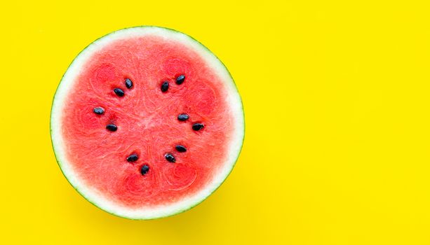 Slice of watermelon on yellow background. Copy space