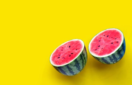 Fresh watermelon on yellow background. Copy space