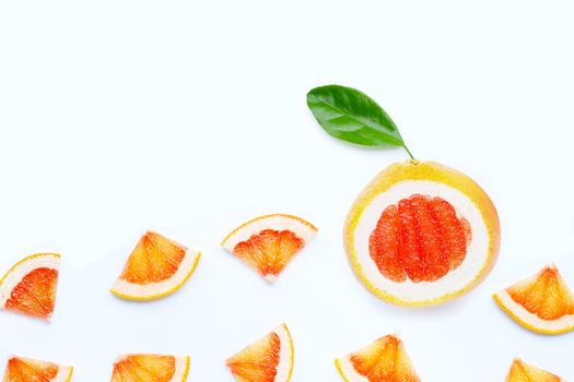 High vitamin C. Juicy grapefruit slices with leaf on white background.