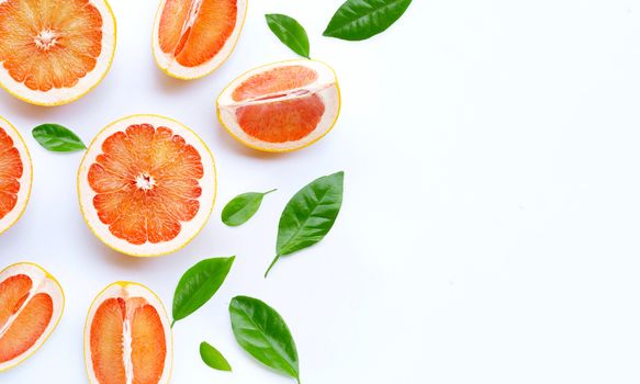 High vitamin C. Juicy grapefruit with leave on white background. Copy space