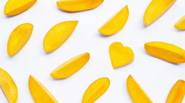 Tropical fruit, Mango slices on white background. Top view
