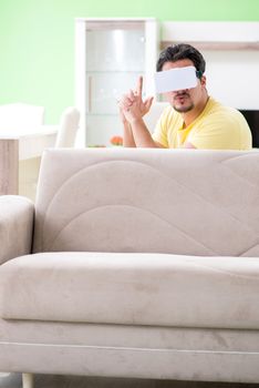 Young man with virtual reality goggles