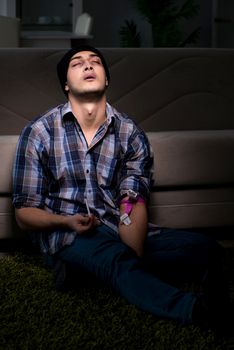 Young man in agony having problems with narcotics 