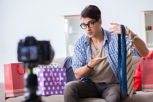 Male fashion blogger recording video for vlog